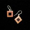 06_fused orange/copper dichroic on black glass, sterling silver ear wire, .5" $35. SOLD (LA)