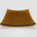 02_ Irridized amber fused glass plate Kokopelli 8" $125 SOLD